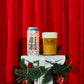 To Øl Julesovs Can and Beer Glass Pour with Christmas Red background.